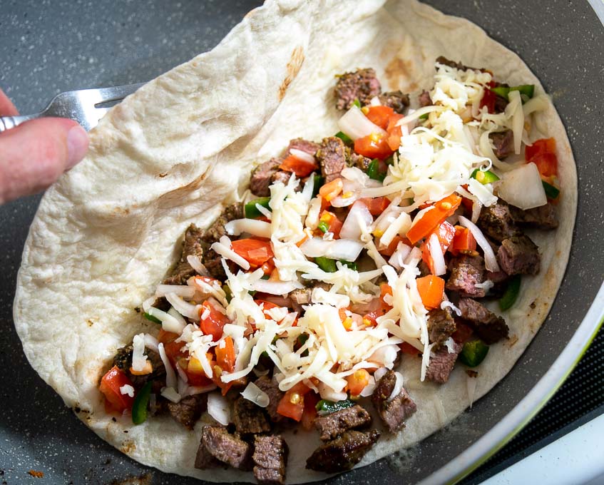 Adding Pico de Gallo to the quesadillas