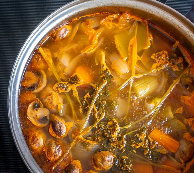 Veggie stock with tomatoes and mushrooms after simmering