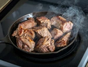 Searing beef brisket for Birria de Res