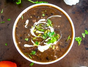 Serving Bean Soup with Crema, cilantro and a squeeze of lime
