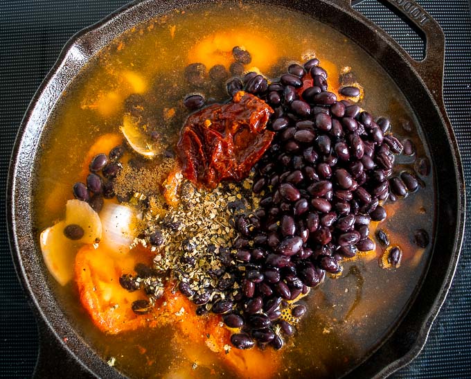 Adding beans and chipotle to the saucepan