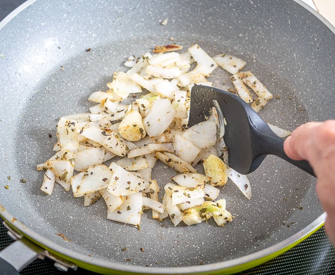 Adding Mexican Oregano and cumin to the onion