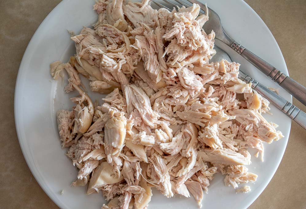 Shredding chicken using two forks