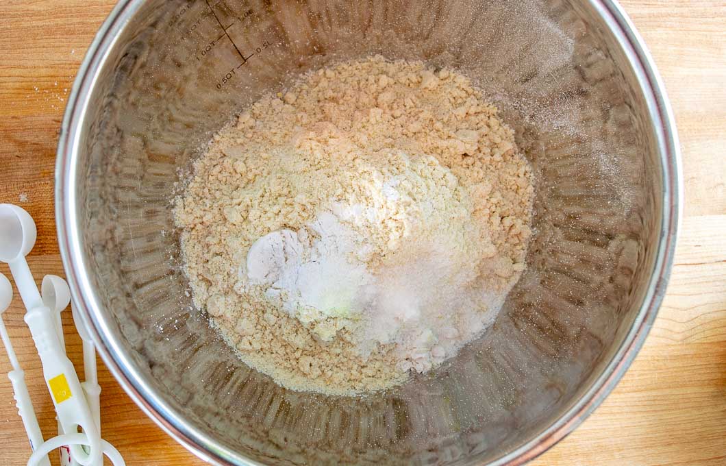 Adding dry ingredients to a mixing bowl
