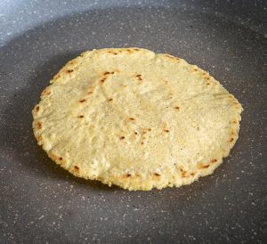 Cooking a corn tortilla in a dry skillet