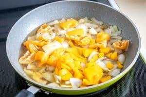 Adding mango to the pan