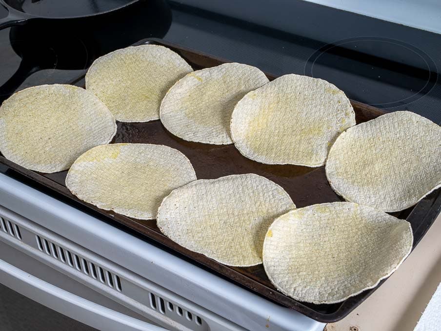 Adding oil to corn tortillas