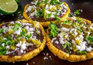 Sopes with cilantro and a squeeze of lime