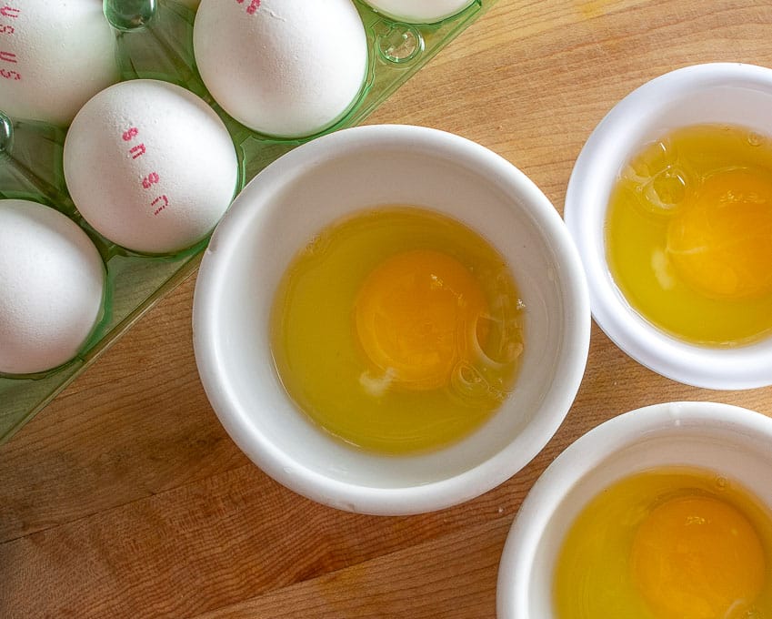 Cracking eggs in individual bowls