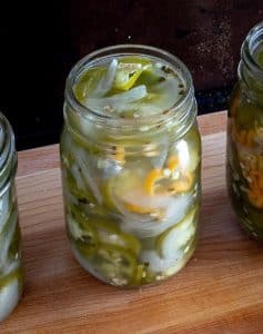 Jar of Pickled Jalapenos with 2 sliced Habaneros inside