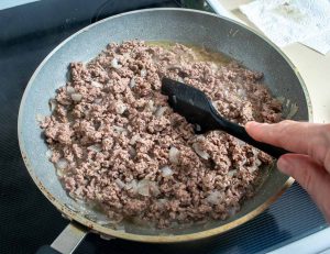After the ground beef has browned drain off some fat