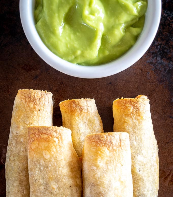 It's such a treat to remember you've got some of these Spicy Beef Taquitos in the fridge/freezer for a quick meal! I dipped this batch in some Salsa de Aguacate and they were delicious! mexicanplease.com