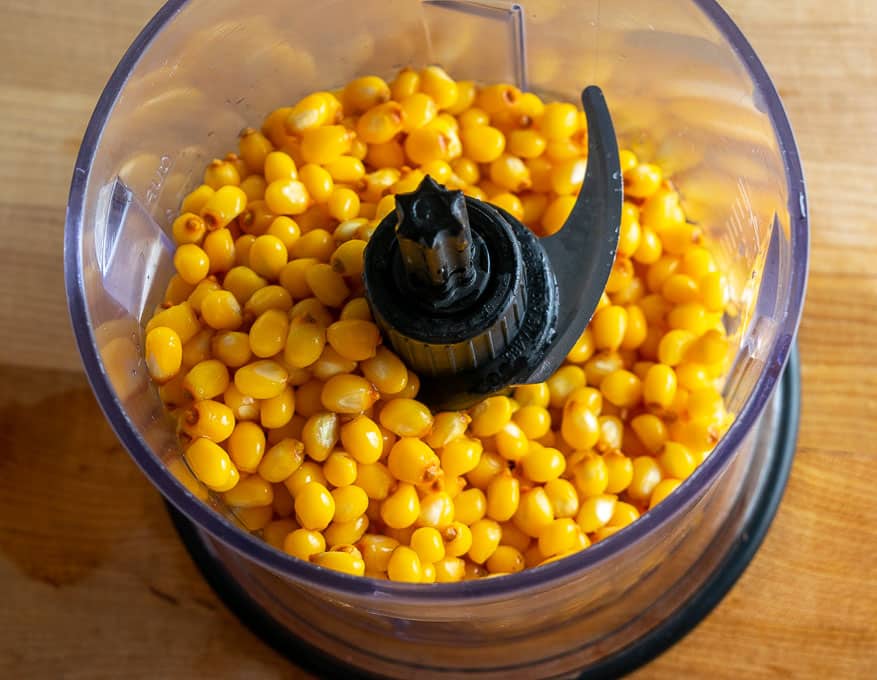 Adding corn to the food processor