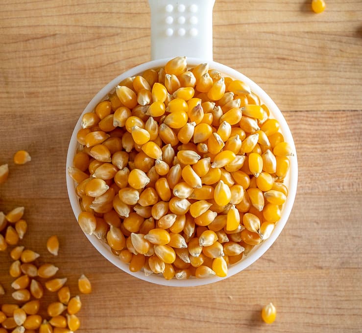 Overhead view of single cup of popcorn kernels