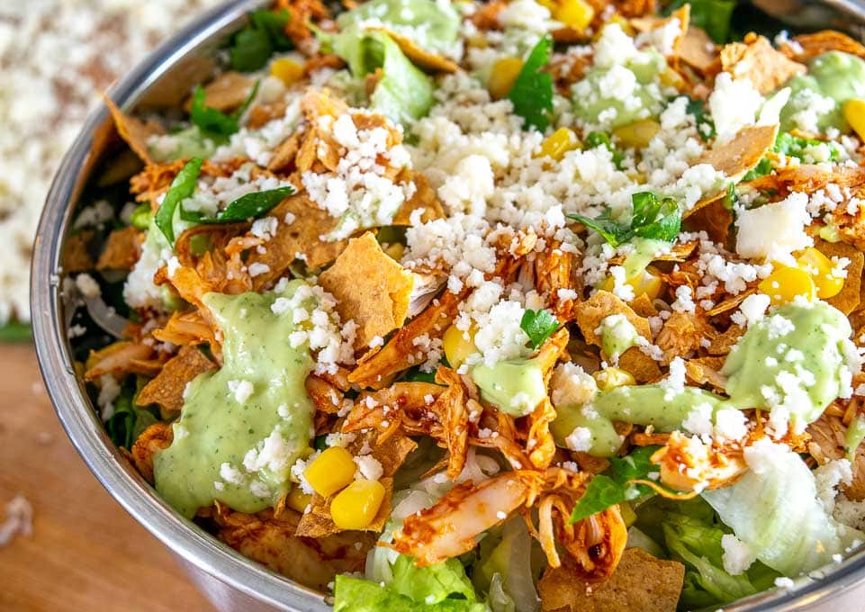 Here are two great options for some home-cooked Mexican Chicken Salads! The first is a traditional Chicken Taco Salad, and the second relies on some Spicy Cabbage Slaw. 