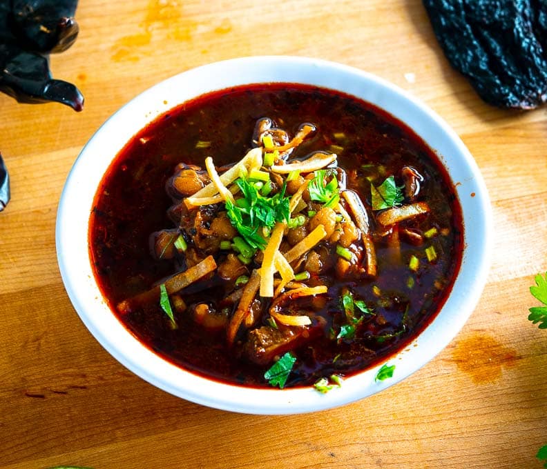 Red Pozole with crispy tortilla strips and freshly chopped cilantro