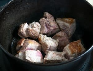 Searing pork chunks in cast iron soup pot