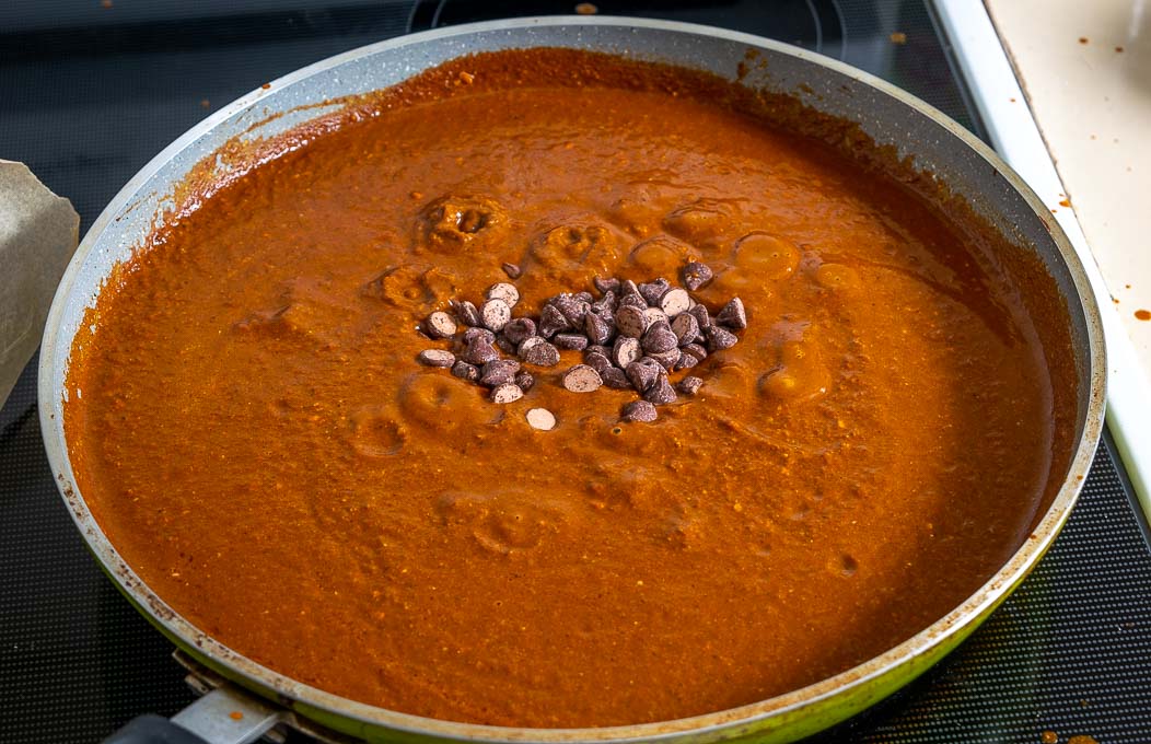 Adding chocolate to the Mole Poblano sauce