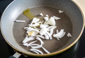 Cooking onion and garlic clove