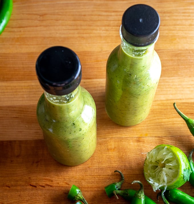 Two 5 oz. bottles of homemade Serrano hot sauce