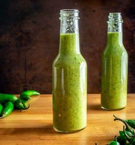 Here's an easy recipe for a wicked batch of Serrano Hot Sauce! With a half pound of Serranos you'll get two bottles worth of delicious, fiery hot sauce.