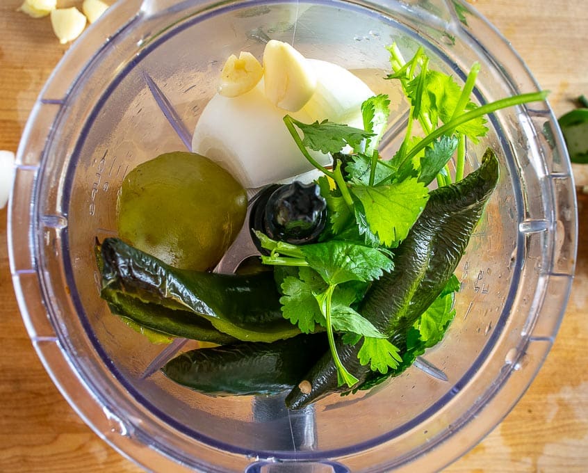 Blender full of Chile Verde ingredients