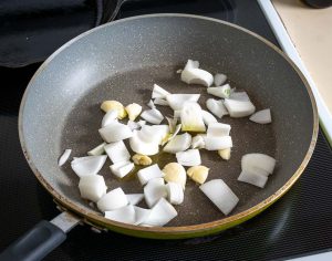 Cooking onion and garlic for the Birria sauce