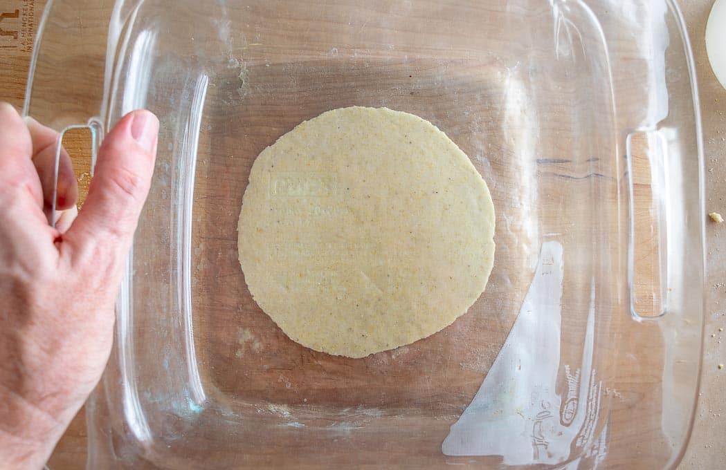 Flattening dough balls with casserole dish