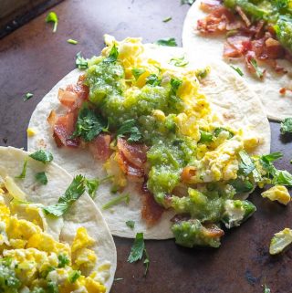 Breakfast Tacos with eggs, bacon, Salsa Verde, and cilantro