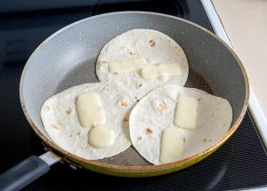 Warming up tortilas in a dry skillet