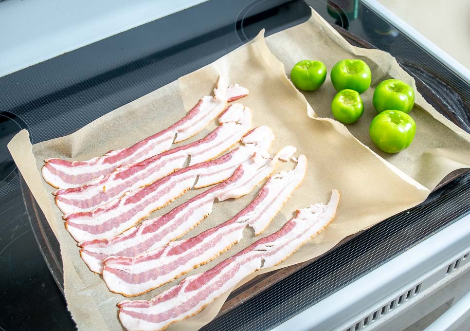 Adding bacon and tomatillos to oven