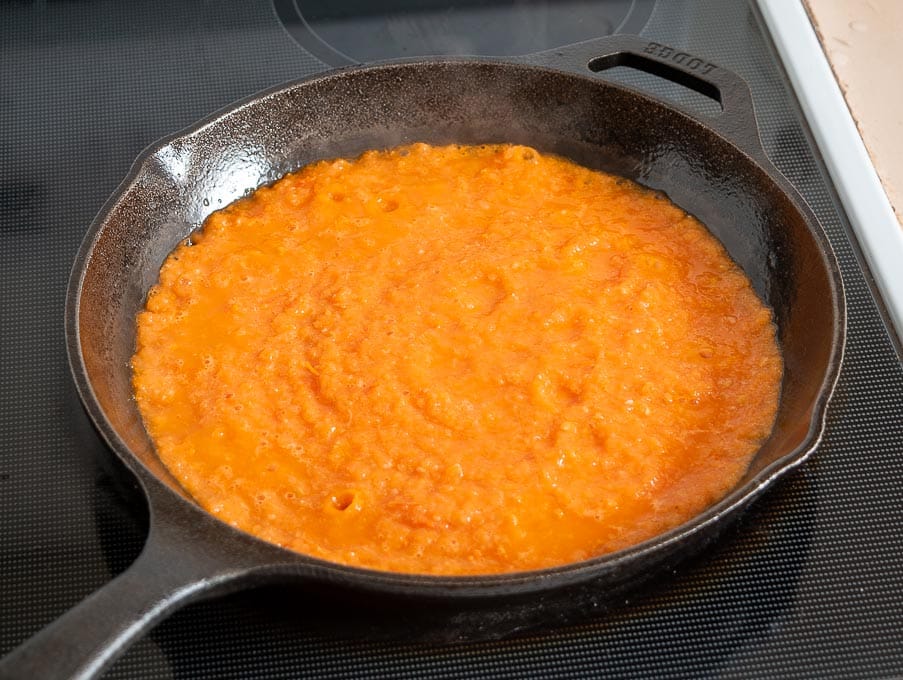 Cooking the tomato onion garlic mixture in some oil 