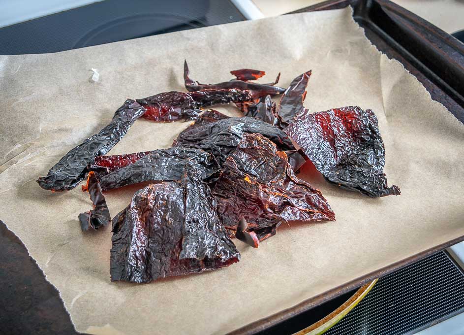 Roasting dried chile pieces in the oven