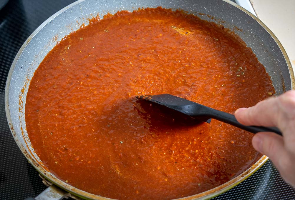 Cooking the enchilada sauce over medium heat