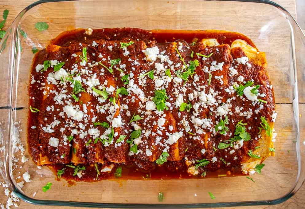 Easy Enchiladas  Frozen chimichangas from Costco Green enchilada sauce Jack cheese Onion (optional) Directions: Pour a littl…
