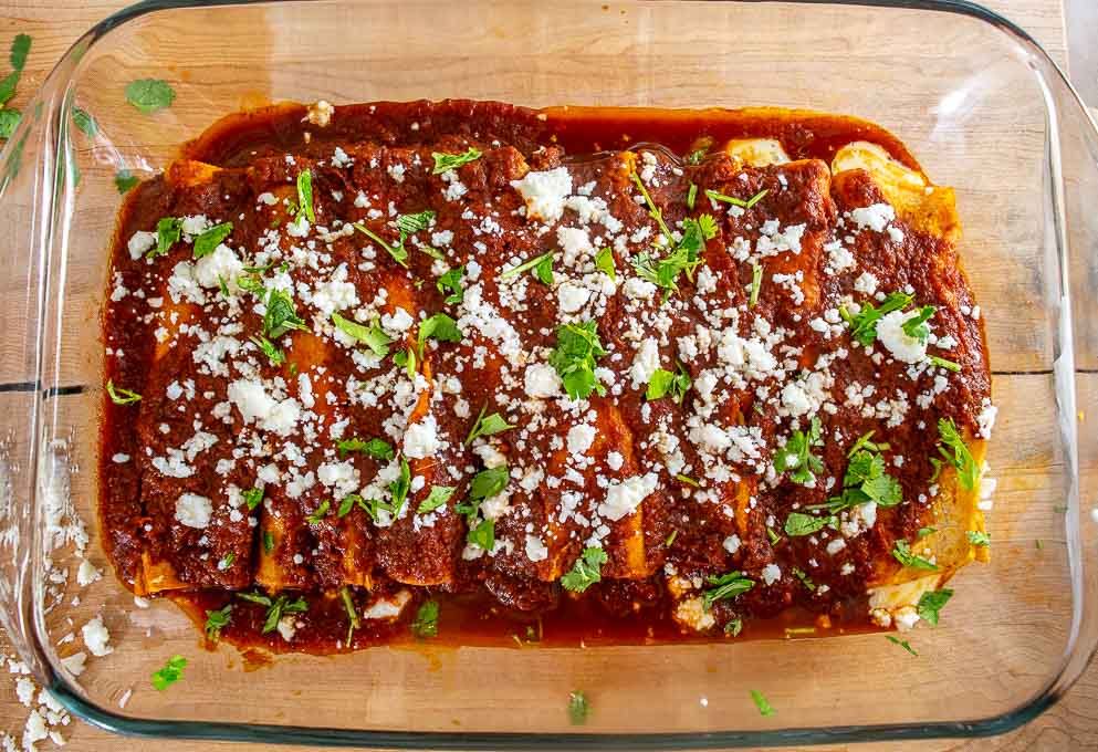  This is a simple, rewarding recipe for a batch of Cheese and Onion Enchiladas. I used Ancho and Guajillo chiles for this batch and they were delicious!