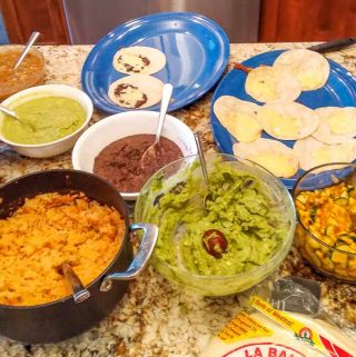 Full taco bar full of Salsas and Guacamole