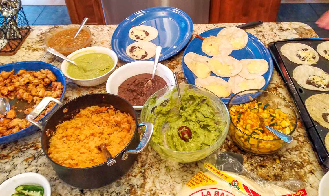 Full taco bar full of Salsas and Guacamole