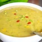 Hatch Chile Soup with cilantro stems and hot sauce