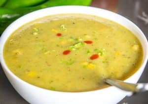 Hatch Chile Soup with cilantro stems and hot sauce