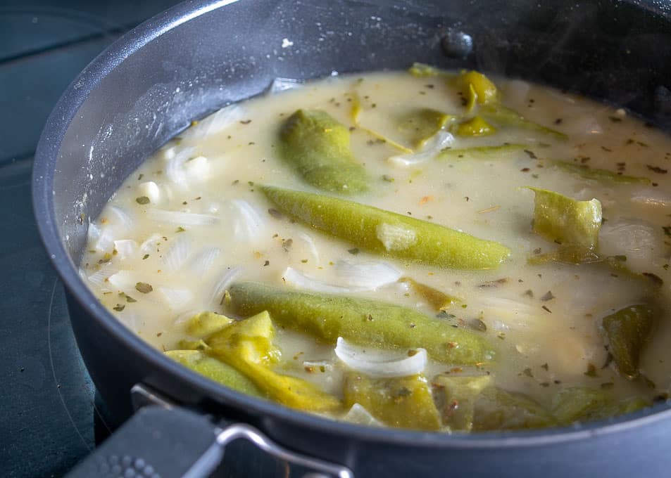 Adding the roasted Hatch pieces to the soup