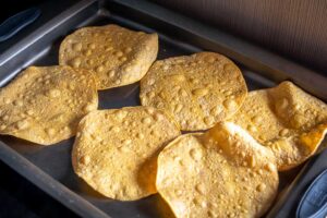 Baking tostada shells in the oven for 8 minutes