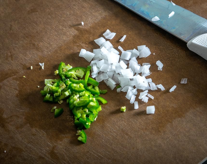 Chopping up onion and jalapeno for the eggs