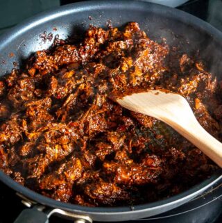 Here's an easy recipe for a big batch of savory shredded pork in adobo sauce -- perfect for tacos, burritos, tostadas, and even tortas!