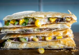 Zucchini Corn Quesadilla chopped up into quarters after cooking