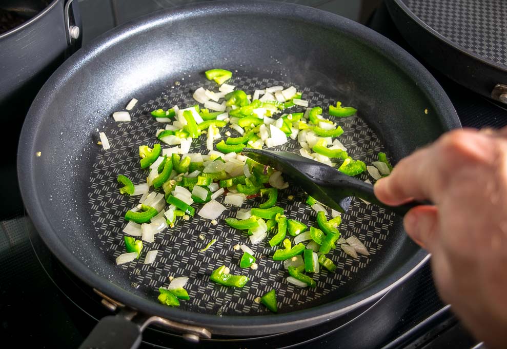 Cooking some jalapeno and onion in a skillet