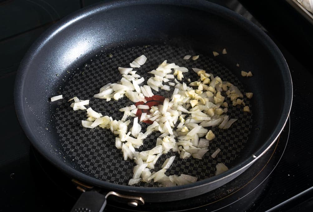 Cooking some onion and garlic for the Hatch sauce.