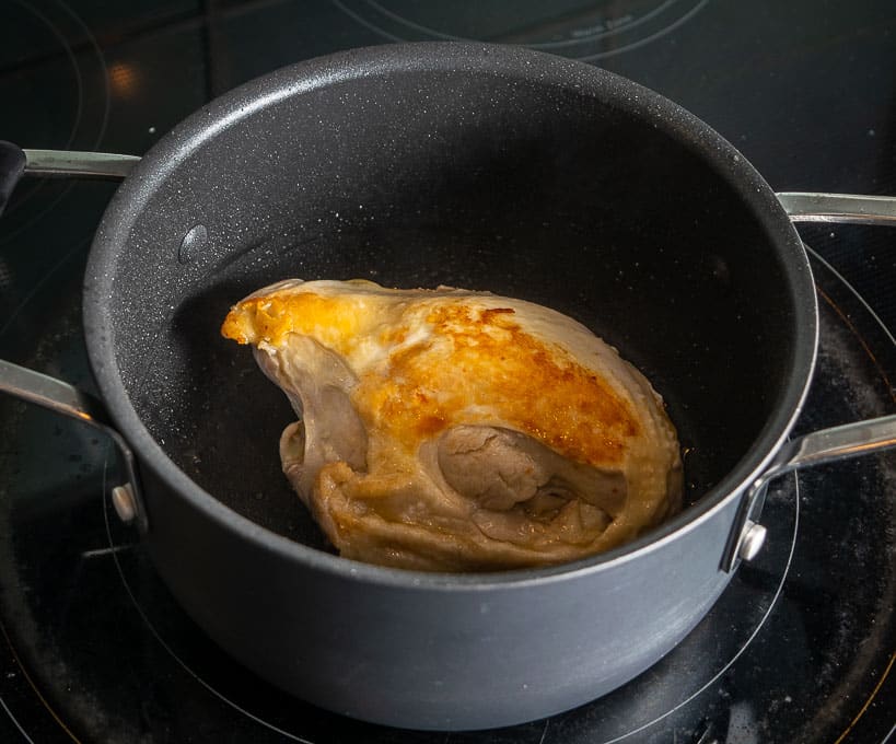 Browning the bone-in chicken breast