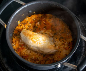 Adding chicken to the saucepan
