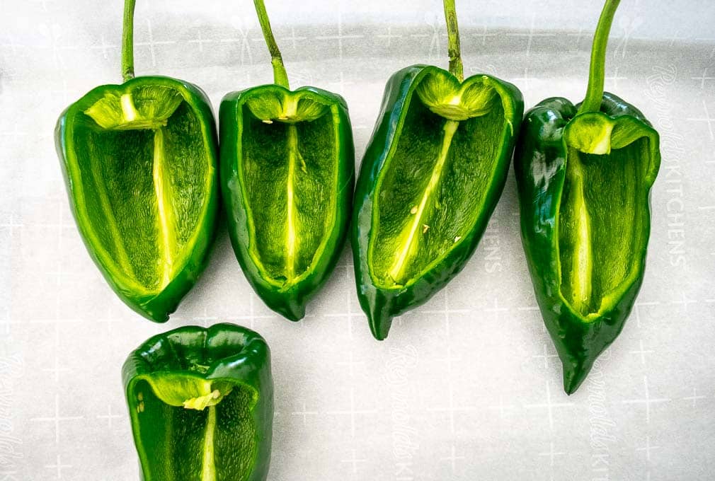 Carving up the Poblano chiles before roasting them